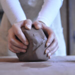 Hands wedging terracotta clay Handcrafted Ceramic Raw Terracotta