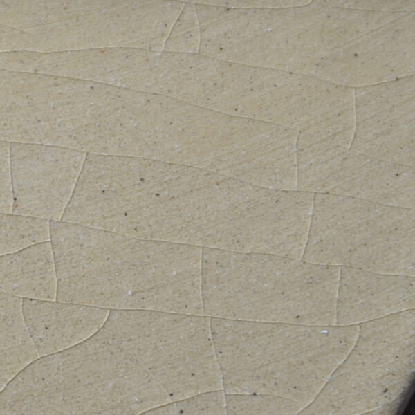 Closeup of hairline crazing cracks in handmade tiles